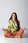 Young Indian Woman Posing Sitting On The Floor Stock Photo