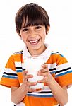 Young Kid Holding A Glass Of Milk Stock Photo