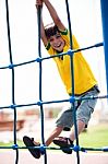 Young Kid On Playstructure Stock Photo