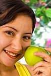 Young Lady About To Eat An Apple Stock Photo