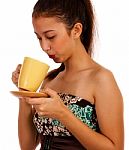 Young Lady Cooling Her Coffee Stock Photo