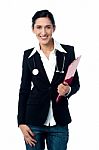 Young Lady Doctor Holding Clipboard Stock Photo