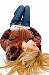 Young lady lying on floor Stock Photo