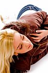 Young lady lying on floor Stock Photo