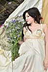 Young Lady Sleeping With Flowers Stock Photo