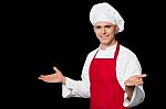 Young Male Chef Welcoming His Guests Stock Photo