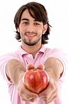 Young Male Holding Apple Stock Photo