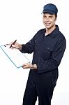 Young Male Holding Clipboard Stock Photo