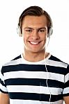 Young Male Listening Music Stock Photo