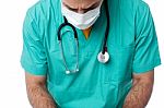 Young Male Physician Wearing Surgical Mask Stock Photo