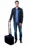 Young Man All Set To Fly For His Vacations Stock Photo