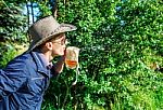 Young Man Blowing Foam From A Beer In A Mug Stock Photo