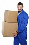 Young Man Carrying Cardboard Box Stock Photo