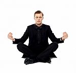 Young Man Doing Meditation Stock Photo