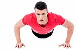 Young Man Doing Push-ups Stock Photo