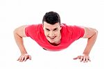 Young Man Doing Push-ups Stock Photo