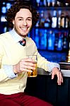 Young Man Holding A Glass Of Beer Stock Photo