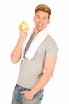 Young Man Holding An Apple Stock Photo