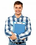 Young Man Holding Clipboard Stock Photo