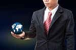 Young Man Holding World Globe In Hand Stock Photo