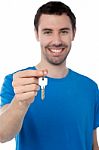 Young Man In Holding Key Stock Photo