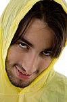 Young Man In Yellow Raincoat Stock Photo