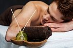 Young Man Relaxing On Massage Table Stock Photo