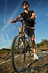 Young Man Riding Mountain Bike Stock Photo