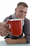 Young Man Showing Coffee Mug Stock Photo