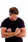 Young Man Showing His Muscles Stock Photo