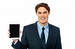 Young Man Showing Newly Launched Tablet Device Stock Photo