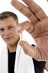 Young Man Showing Pill Stock Photo