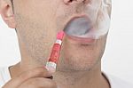 Young Man Smokin Electic Cigarette Stock Photo