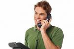 Young Man Talking On The Phone Stock Photo