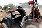 Young Man Turning Quad Bike Stock Photo