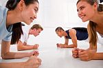 Young Multi Ethnic People Exercising In Gym Stock Photo