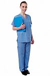 Young Nurse Holding Clipboard Stock Photo