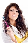 Young Pretty Female Holding Toothbrush Stock Photo