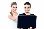 Young Pretty Girls Watching Movies On Laptop Stock Photo