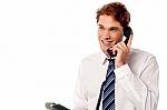 Young Professional Answering Phone Call Stock Photo