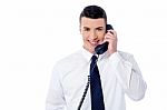 Young Professional Answering Phone Call Stock Photo