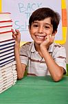 Young School Kid Smiling At Camera Stock Photo