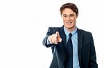 Young Smiling Businessman Pointing You Out Stock Photo