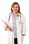 Young Smiling Doctor Holding Clipboard Stock Photo