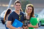 Young Students Looking At The Camera After Class Stock Photo