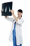 Young Surgeon Holding X-ray Sheet Of A Patient Stock Photo