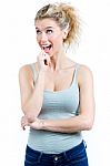Young Surprised Woman Holding Her Face Stock Photo