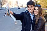 Young Tourist Couple Use Their Map And Pointing Where They Want Stock Photo