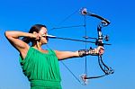 Young Woman Aiming Arrow Of Compound Bow Stock Photo