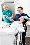 Young Woman At The Dentist Stock Photo